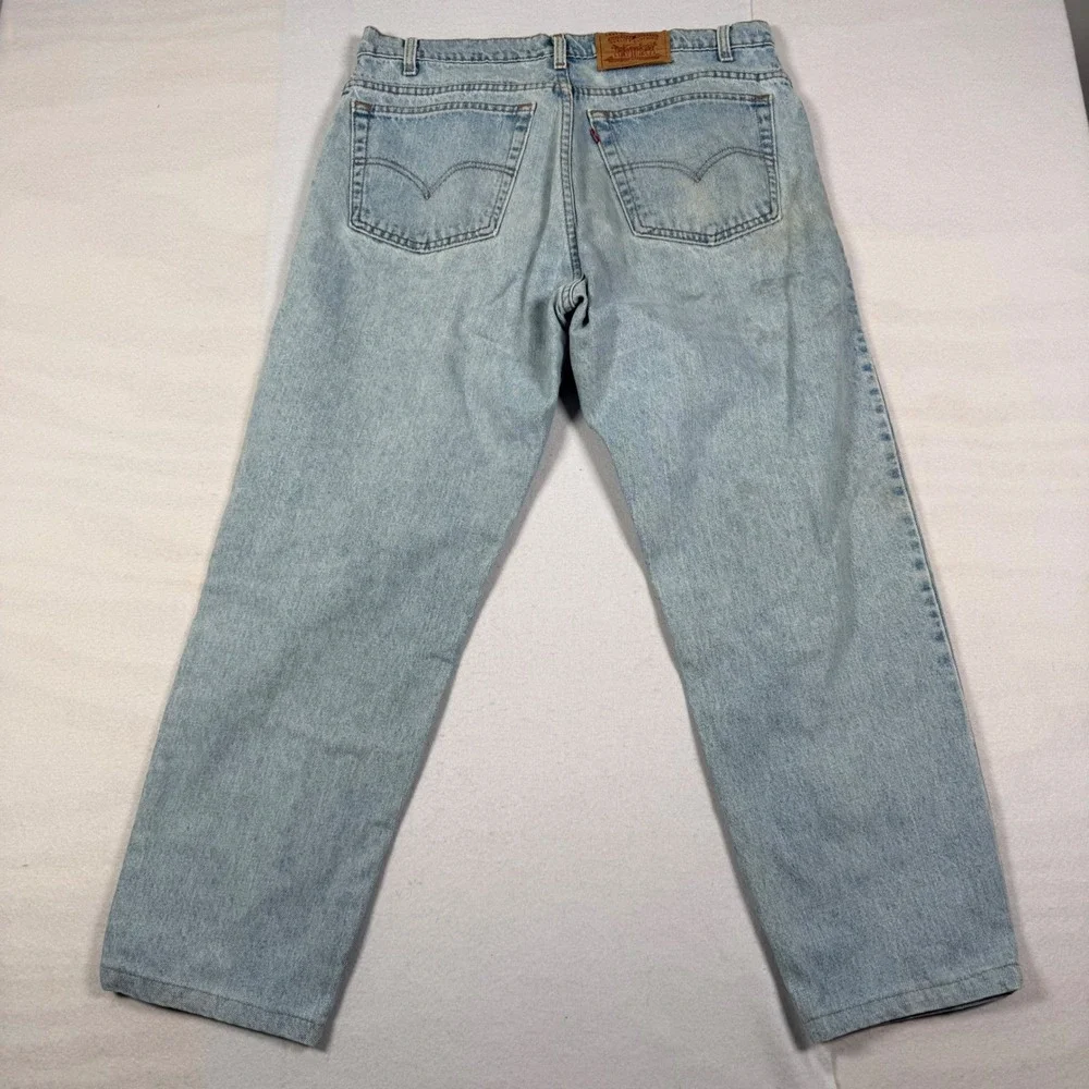 Vintage 90s Levis 550 Relaxed Fit Tapered Jeans Light Wash 38x28 Made in USA